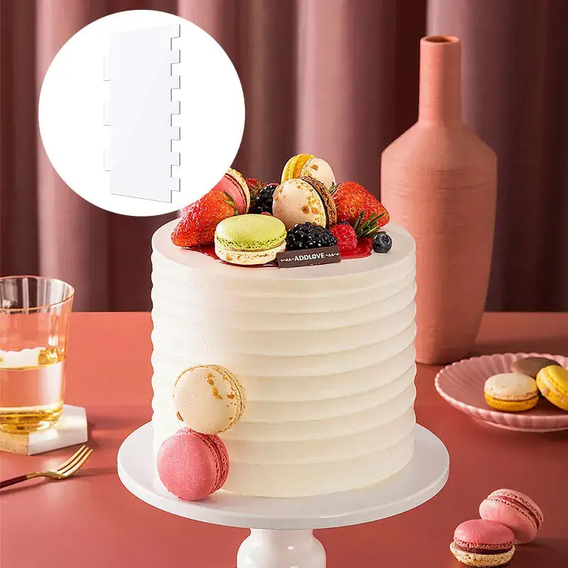 A white ribbed cake with smooth fondant and colorful toppings created using clear acrylic decorbites cake cream scrapers