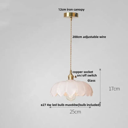 Delicate translucent pink pendant lamp with fluted petal design and brass hardware featuring decorbites amber glass walnut accents
