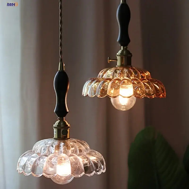 Clear and amber glass walnut pendant lamp with brass accents and black wooden handles for kitchen decorbites amber glass