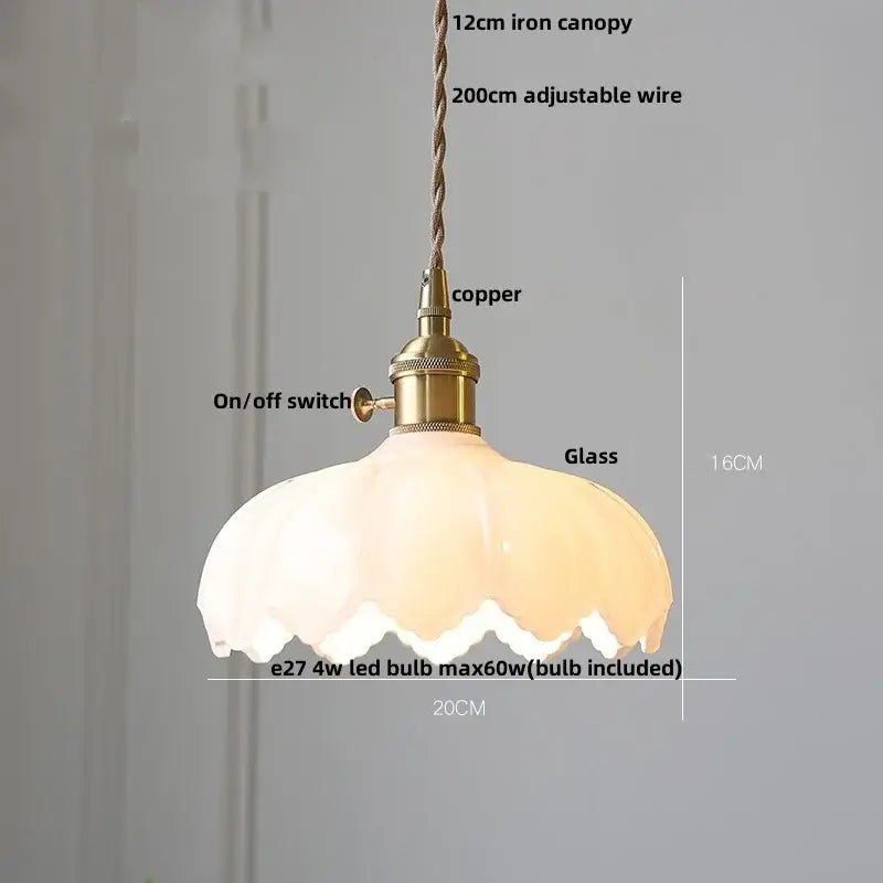 A warm frosted amber glass walnut pendant lamp with brass copper fixture and adjustable braided suspension by decorbites