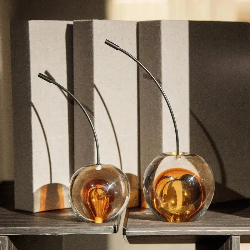 Two amber glass cherry sculpture with slender black metal stems for living room decorbites crystal cherry decor