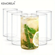 Clear borosilicate drinking glass filled with refreshing beverage garnished with mint and lime in drinking glasses set