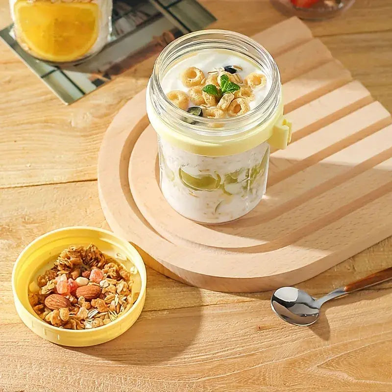 Clear borosilicate drinking glasses set with yellow lid filled with yogurt cereal and mint leaves for kitchen use