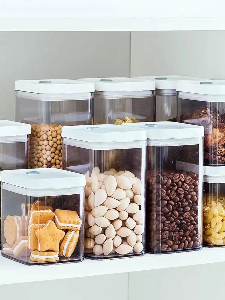 Clear bulk hermetic food storage containers with white lids holding cookies almonds coffee beans and pasta by decorbites