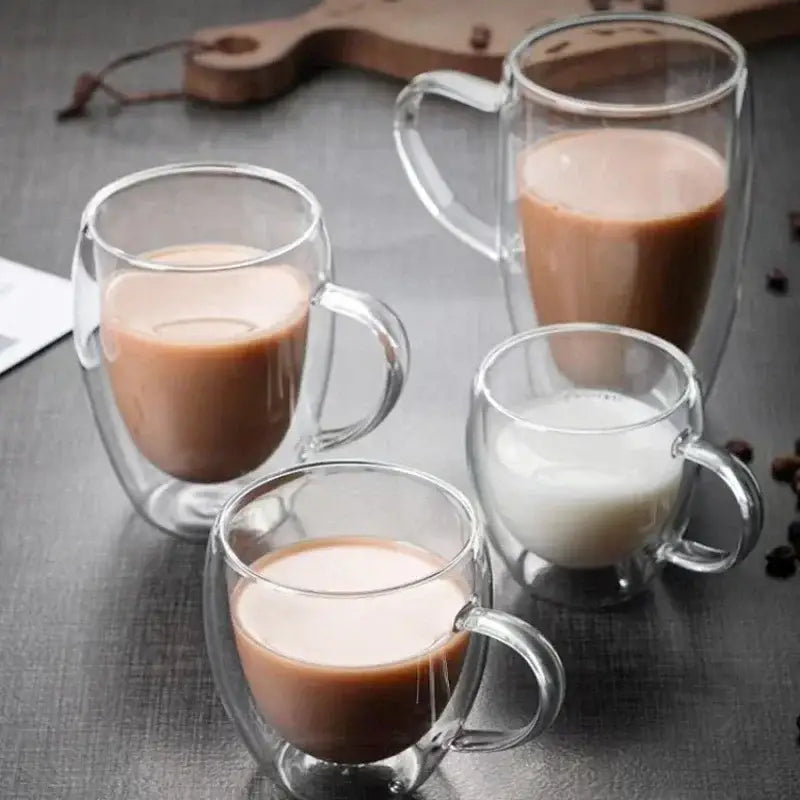 Clear double wall high borosilicate glass mug with handle filled with various coffee and milk shades for dining room use