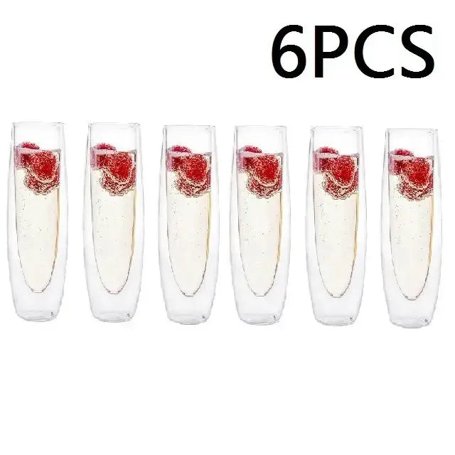 Six clear double wall stemless champagne glasses with raspberries and sparkling liquid for elegant dining room use