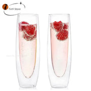 Clear double wall stemless champagne glasses set of six filled with pink bubbly and fresh raspberries