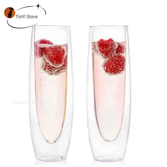 Clear double wall stemless champagne glasses set of six filled with pink bubbly and fresh raspberries