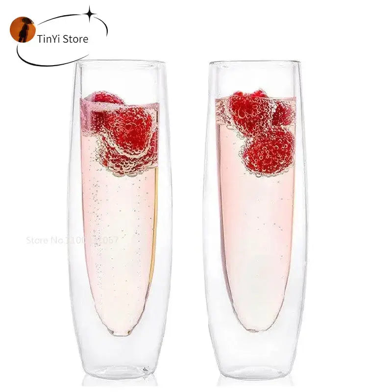Clear double wall stemless champagne glasses set of six filled with pink bubbly and fresh raspberries