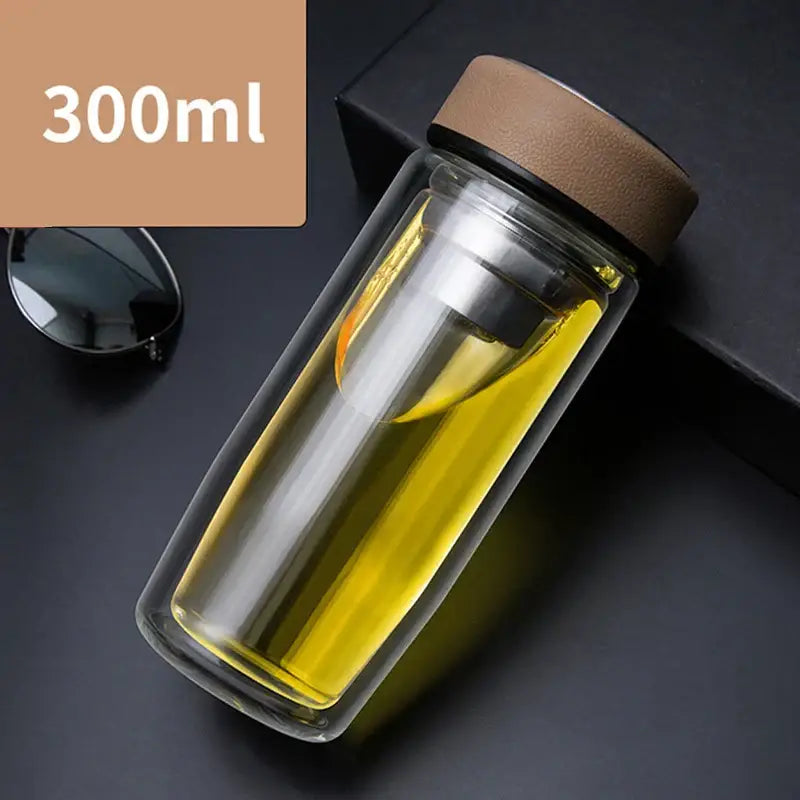 Clear double-walled glass cups travel mug with brown silicone lid and thermal insulation by decorbites double-deck glass