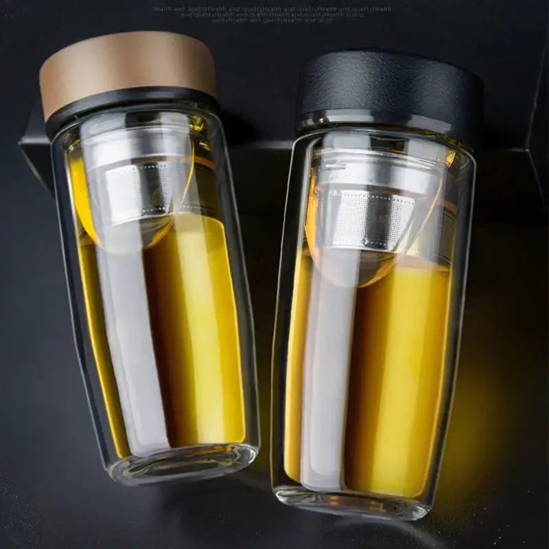 Two clear double-walled glass cups with thermal insulation and stainless steel infusers by decorbites double-deck glass
