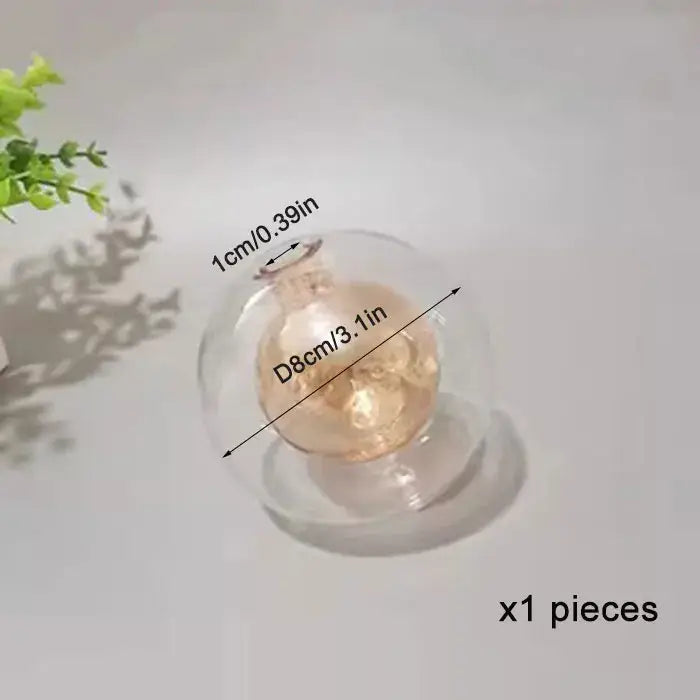 Clear g4 glass shade replacement globe featuring a glowing golden skull ornament for chandelier dining room use