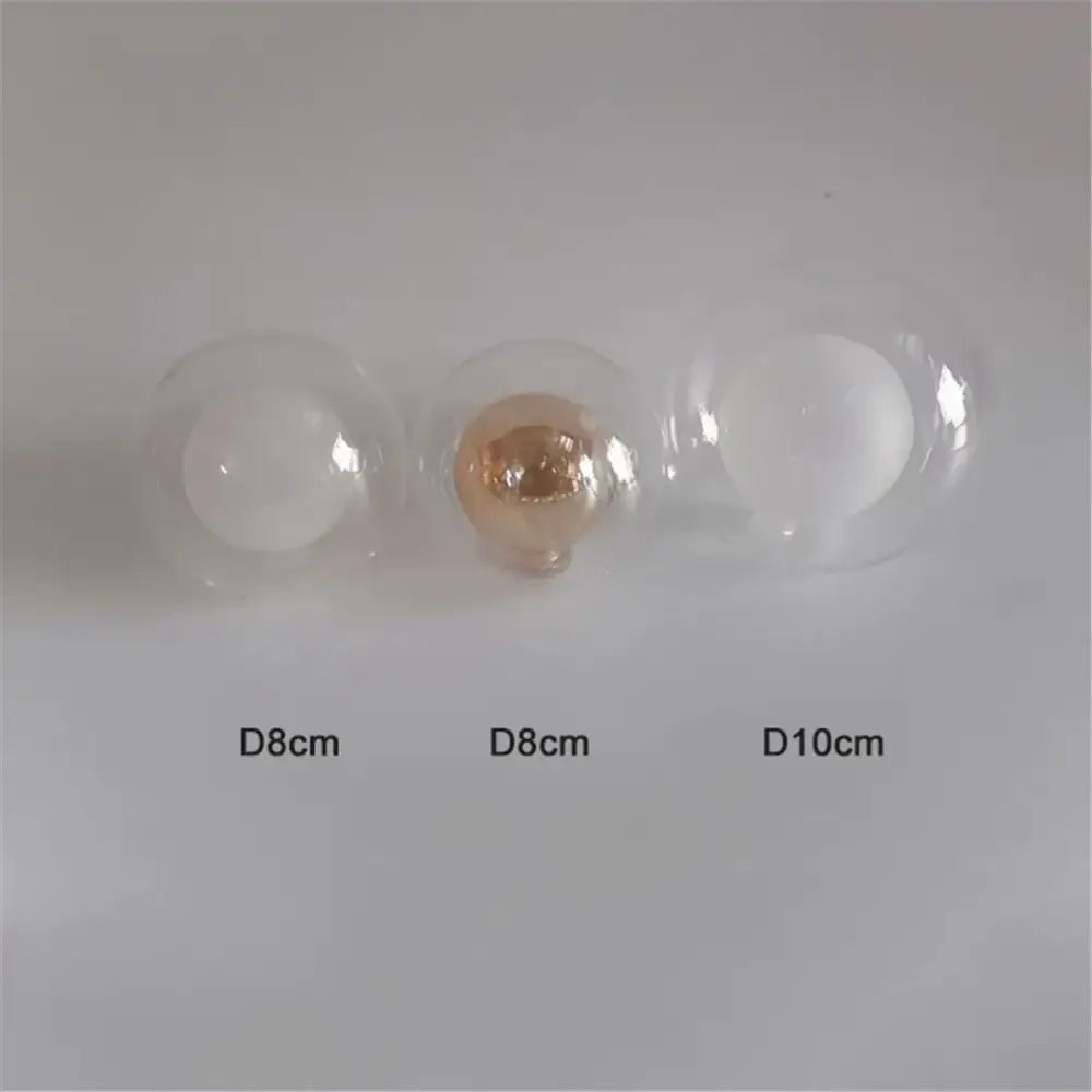 Three clear glass shade replacement globes with one rose gold and two white filaments for chandelier dining room use
