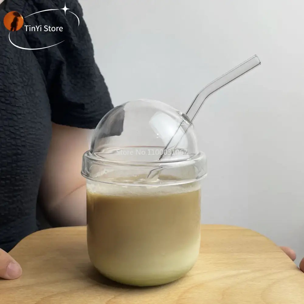 Clear glass bobo cup with ribbed clear glass dome lid and matching curved straw for kitchen milkshake set by decorbites