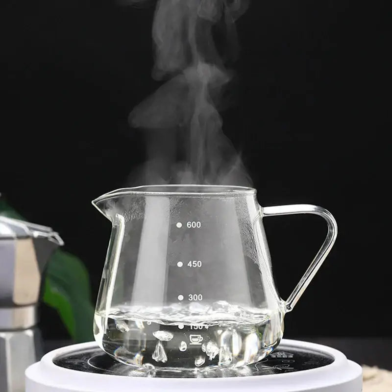 Clear glass coffee pot with measurement markings of 300ml 450ml and 600ml for precise kitchen use