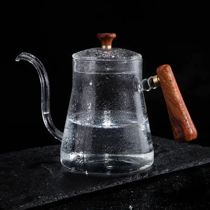 Clear glass hand drip coffee kettle with wooden handle and lid knob filled with water for decorbites glass coffee use