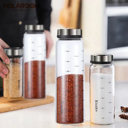 Clear glass spice shaker with silver rotary lid and measurement markings branded kuake for salt sesame pepper storage