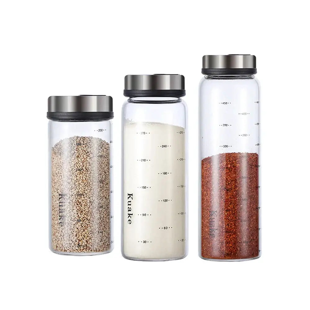 Clear glass spice shaker jars with rotary silver lids labeled kuake for salt sesame pepper storage
