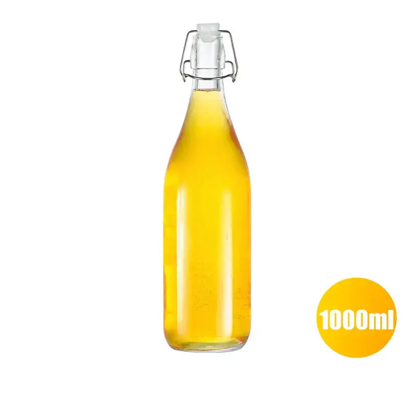 Clear glass storage bottle by decorbites with silver swing top lid filled with golden-yellow liquid for kitchen storage