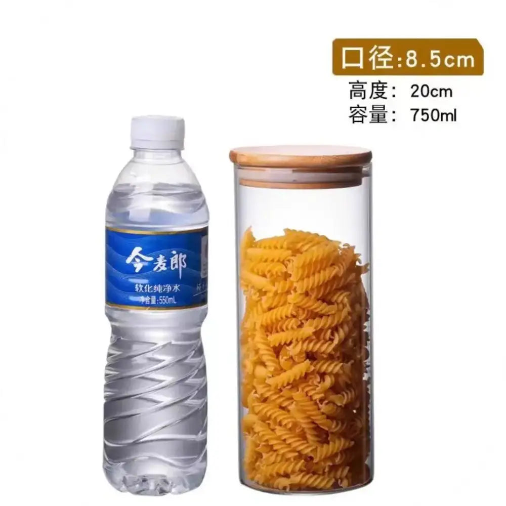Clear glass storage jar with bamboo lid filled with yellow spiral pasta for kitchen organization and glass storage