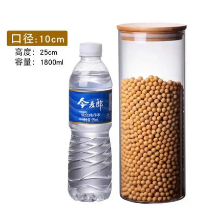 Clear glass storage jar with bamboo lid filled with yellow soybeans for kitchen organization using glass storage jars