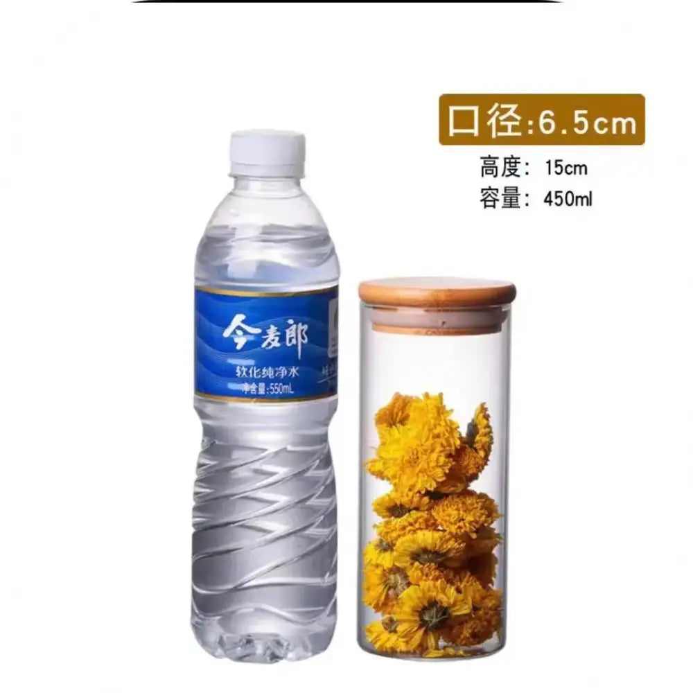 Transparent glass storage jar with bamboo lid filled with yellow dried flowers for kitchen storage jars organization
