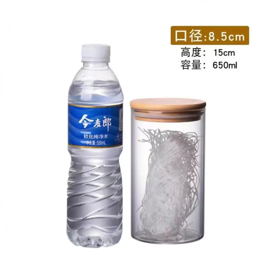 Clear glass storage jar with bamboo lid containing white noodles for kitchen organization and storage jars use