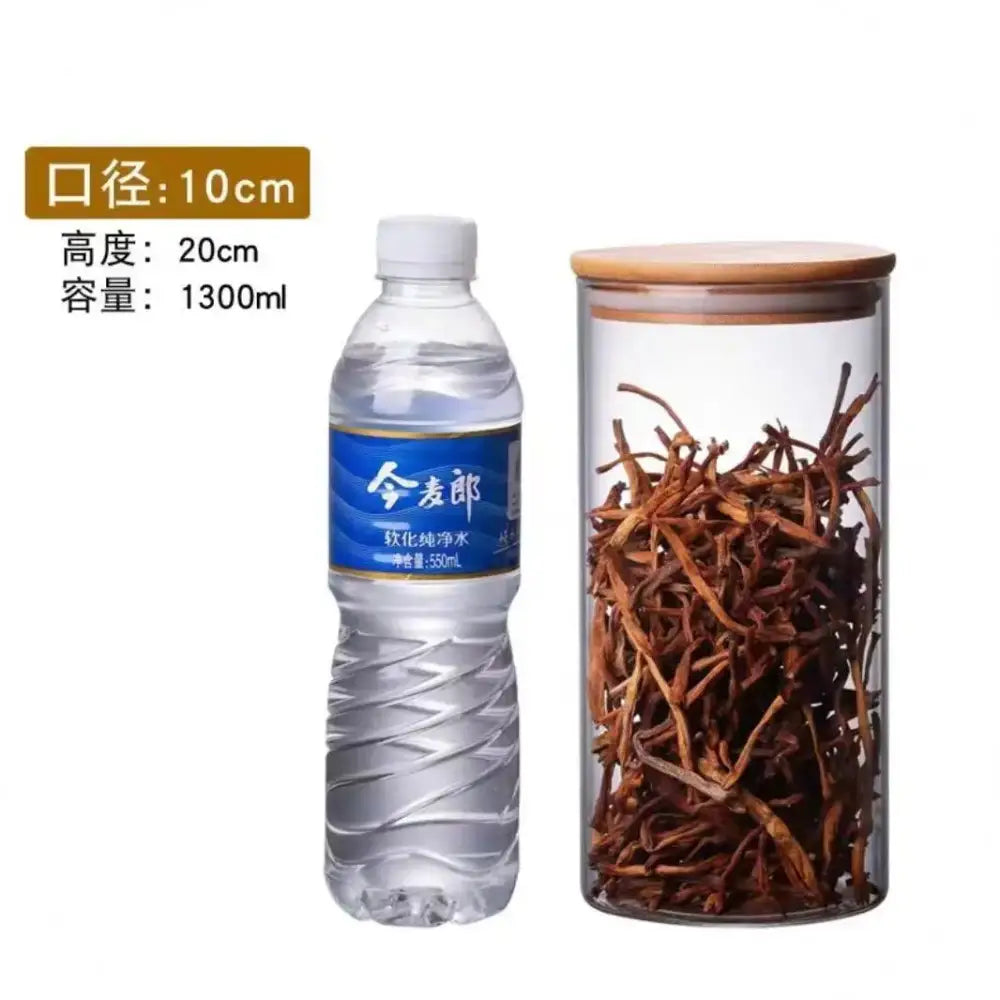 Clear glass storage jar with bamboo lid filled with dried herbs ideal for kitchen organization and glass storage jars