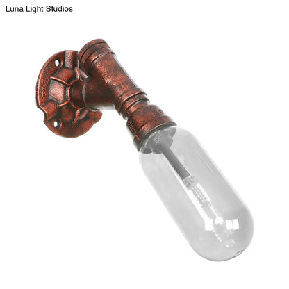 Clear Glass Wall Sconce in Weathered Copper with Pipe Design - Perfect for Loft Dining Rooms