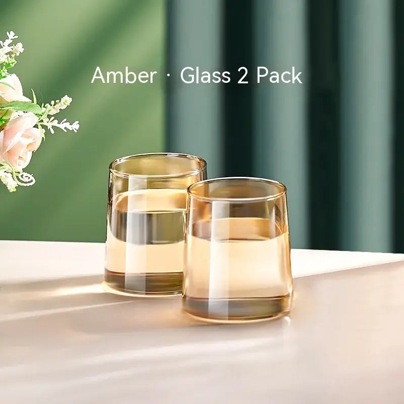 Amber-colored glass tumblers with a sleek modern design and gradient finish from decorbites glass juice kettle set
