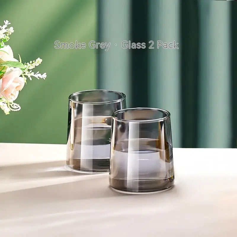 Smoke grey glass tumblers with sleek modern design complement decorbites glass juice kettle set for stylish serving