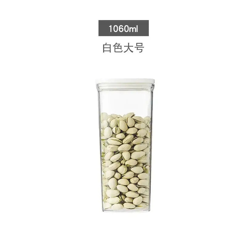 Clear rectangular glass decorbites hermetic kitchen organizer with white lid holding pistachios for food storage