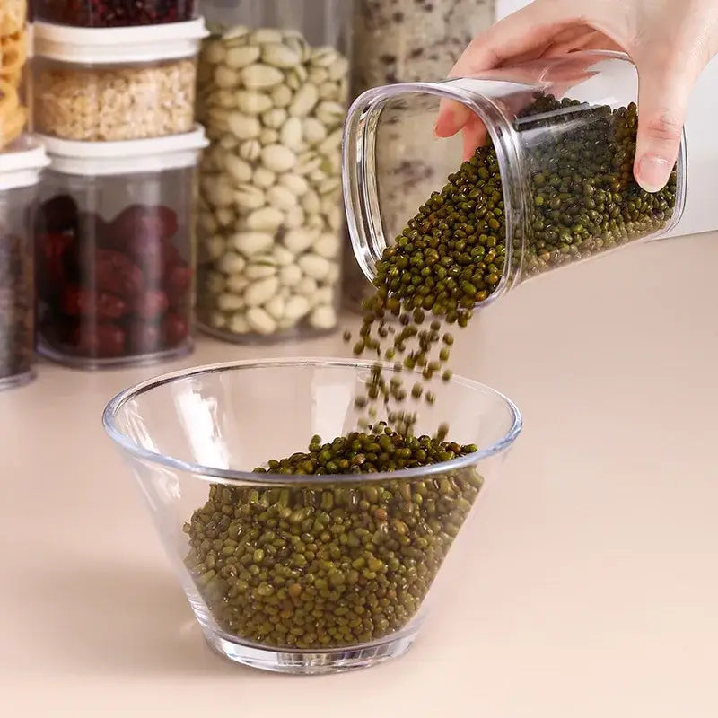 Clear glass rectangular hermetic kitchen organizer with rounded edges filled with green mung beans from decorbites hermetic kitchen