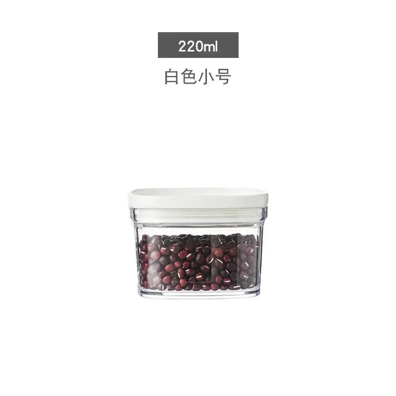 Clear glass container with white lid holding dark red beans for decorbites hermetic kitchen organizer use