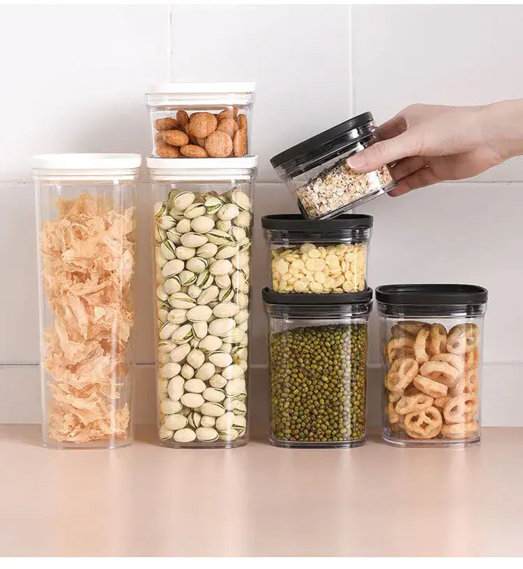 Clear hermetic kitchen organizer by decorbites with clear plastic containers and white and black lids for dry goods storage