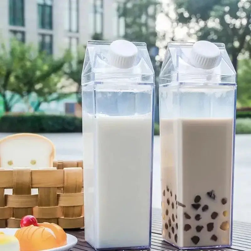 Two transparent plastic clear milk carton water bottles by decorbites with white milk and brown bubble tea content