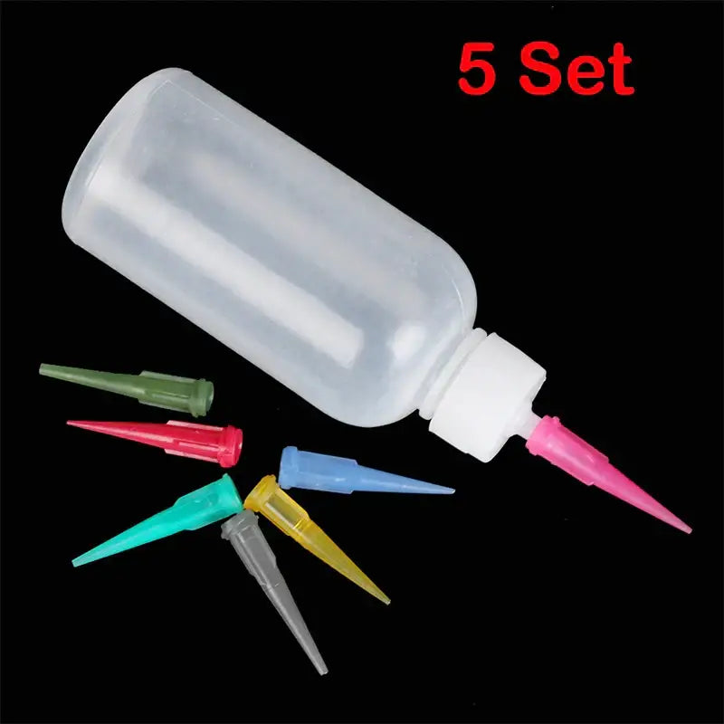 Clear plastic cake decor squeeze bottles with white cap pink nozzle and six colorful interchangeable tips for decorbites cake decor