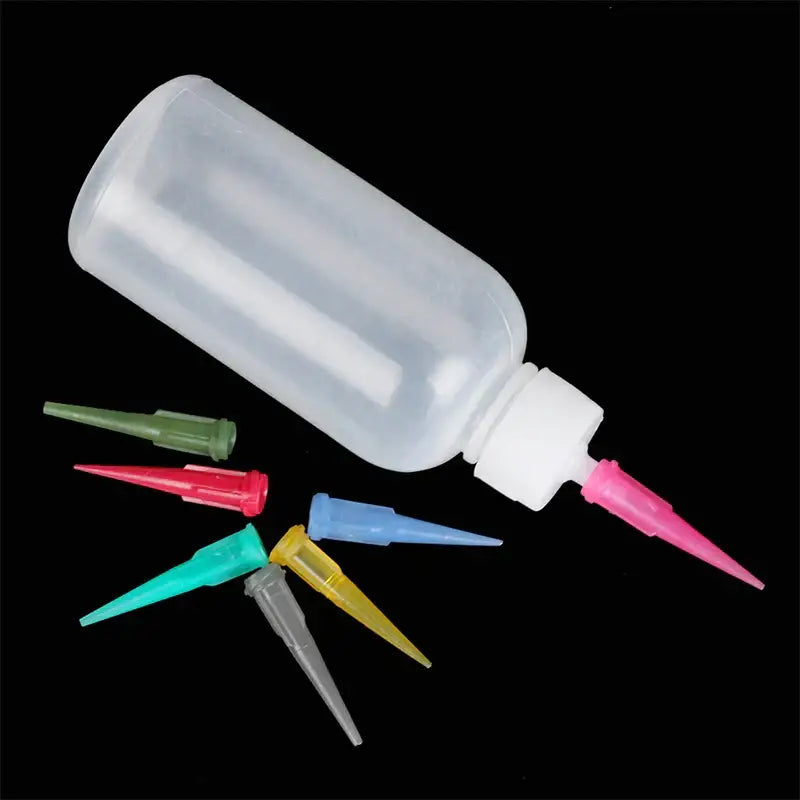 Clear plastic cake decor squeeze bottles with fine pink nozzle and colorful interchangeable tips for decorbites cake decor