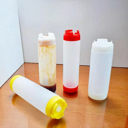 Clear plastic tomato squeeze bottles with red white and yellow caps ideal for kitchen use in a squeeze bottle set