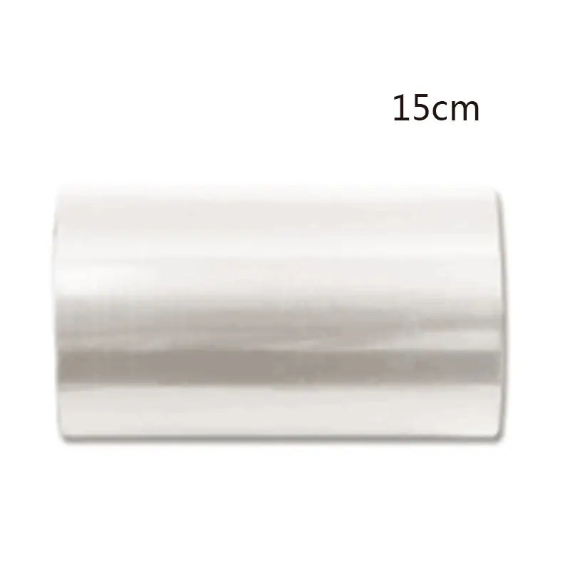 A sleek 15cm long clear transparent plastic cake edge wrap for decorbites cake mousse decorating tool