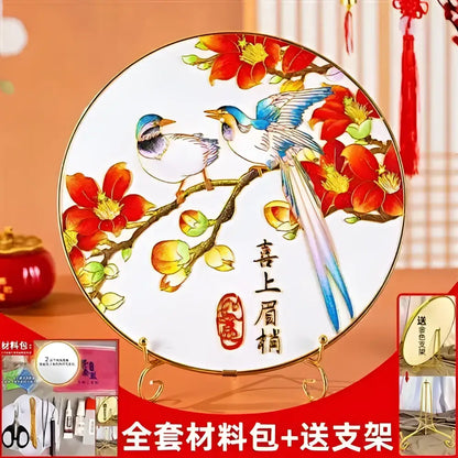 A round white ceramic plate with hand-painted blue and white birds on red blossoms featuring cloisonne silk enamel decorbites diy kit design