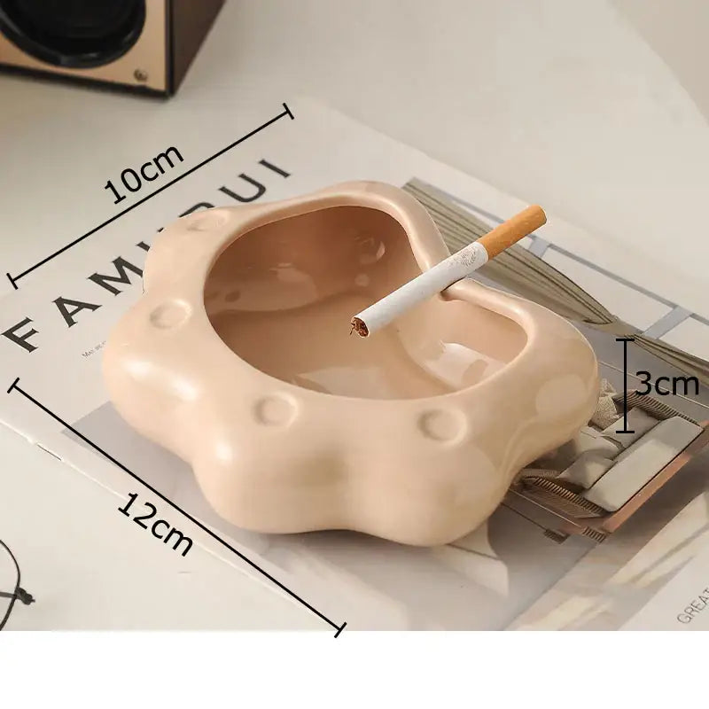Beige cloud cat paw porcelain ashtray with rounded shape and small circular indentations for living room decorbites cat paw gift