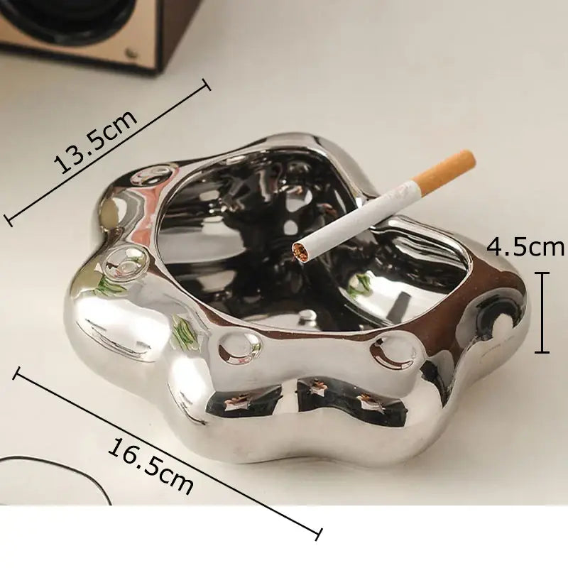 Shiny silver metallic cat paw porcelain ashtray with smooth cloud-like shape and rounded edges for decorbites cat paw gift