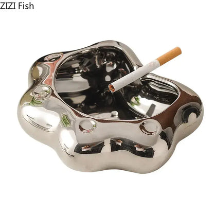 Shiny silver cat paw porcelain ashtray with smooth reflective surface and rounded edges for decorbites cat paw gift