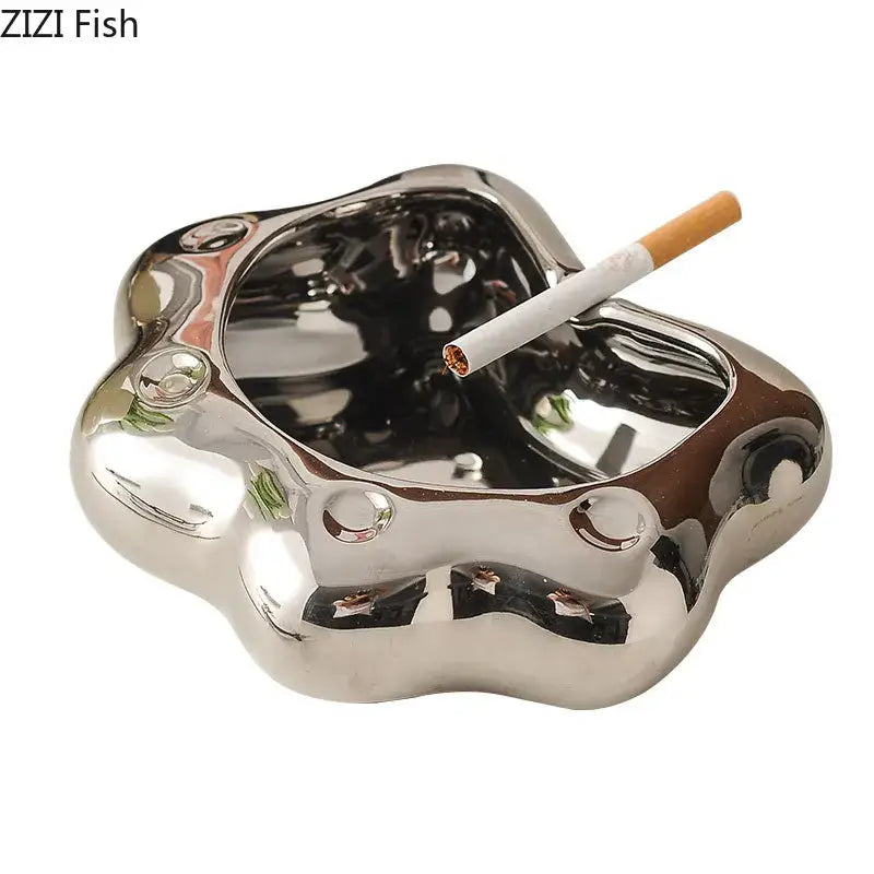 Shiny silver cat paw porcelain ashtray with smooth reflective surface and rounded edges for decorbites cat paw gift