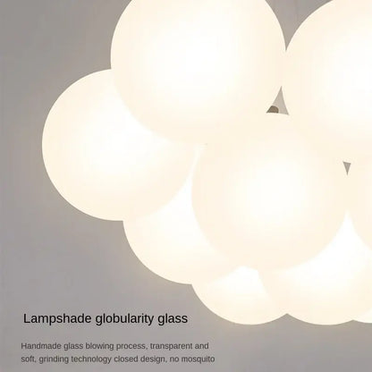 A modern cloud glass ball led pendant light made of translucent white handmade glass for bedroom decorbites decor