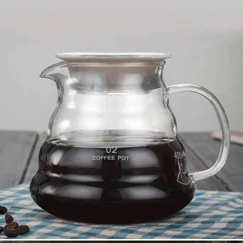 Clear glass coffee kettle with silver lid and measurement markings from decorbites cloud glass for precise brewing