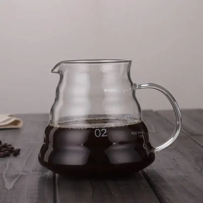 Clear glass cloud glass coffee kettle with silver handle filled with dark brewed coffee marked 02 and 400 ml