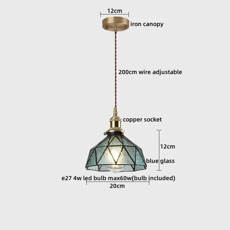 Blue glass pendant light with copper socket and iron canopy complements decorbites ceramic led pendant for dining room