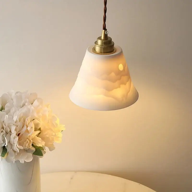 A warm brass ceramic led pendant light with cloud patterned white shade ideal for dining room decorbites ceramic led